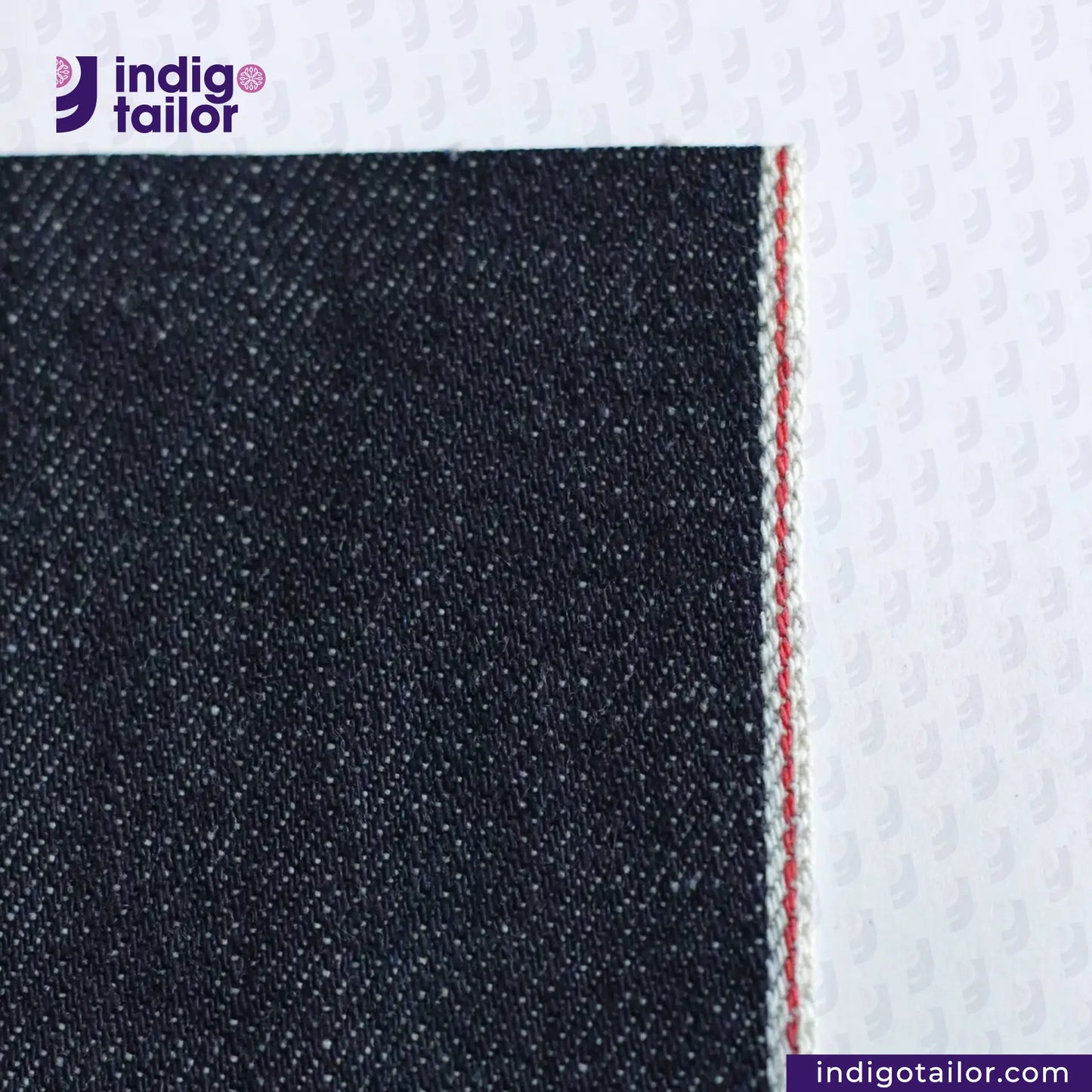 Close-up of VINTAGE SLUB DENIM fabric with a visible brand logo and website text.
