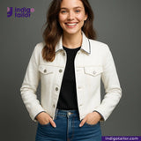 Woman wearing a WHITE DENIM NAVY SELVEDGE jacket over a black shirt with 'Indigotailor' branding.