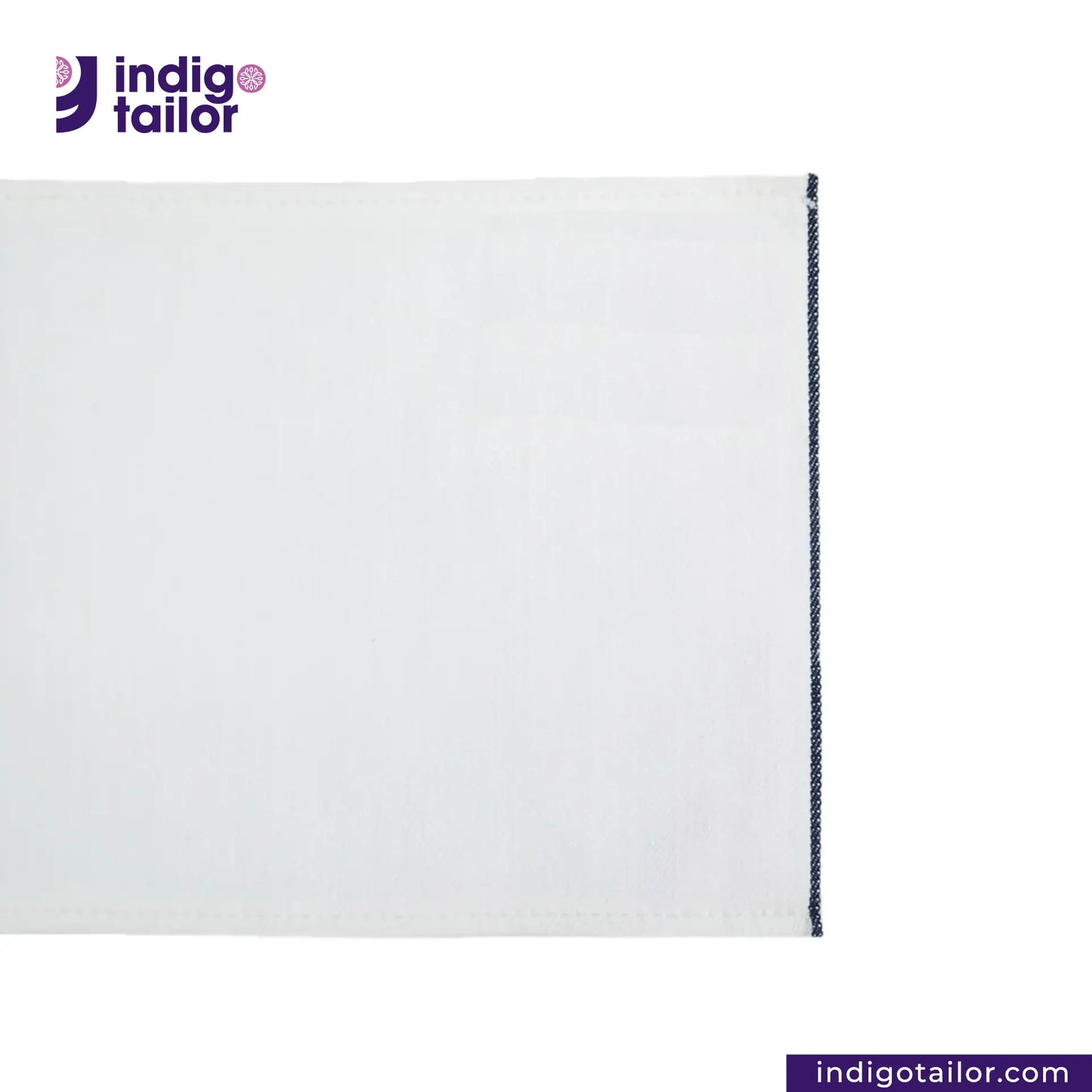 WHITE DENIM NAVY SELVEDGE fabric with a dark blue seam on a white background, featuring the Indigotailor logo.
