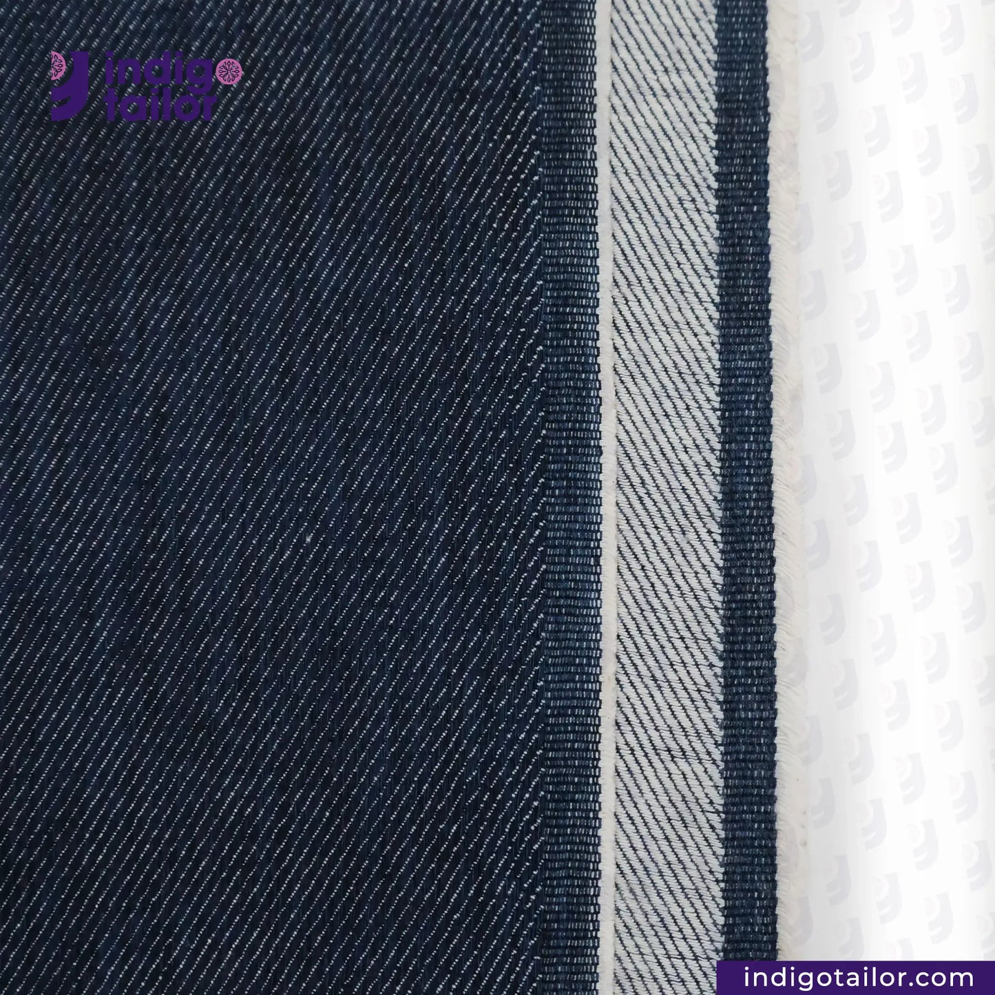 Close-up of WILD INDIGO denim fabric with a brand logo and website text.