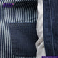 Close-up of a BASEBALL NORAGI (DARK INDIGO) inside pocket with striped fabric background, featuring Indigo Tailor logo.