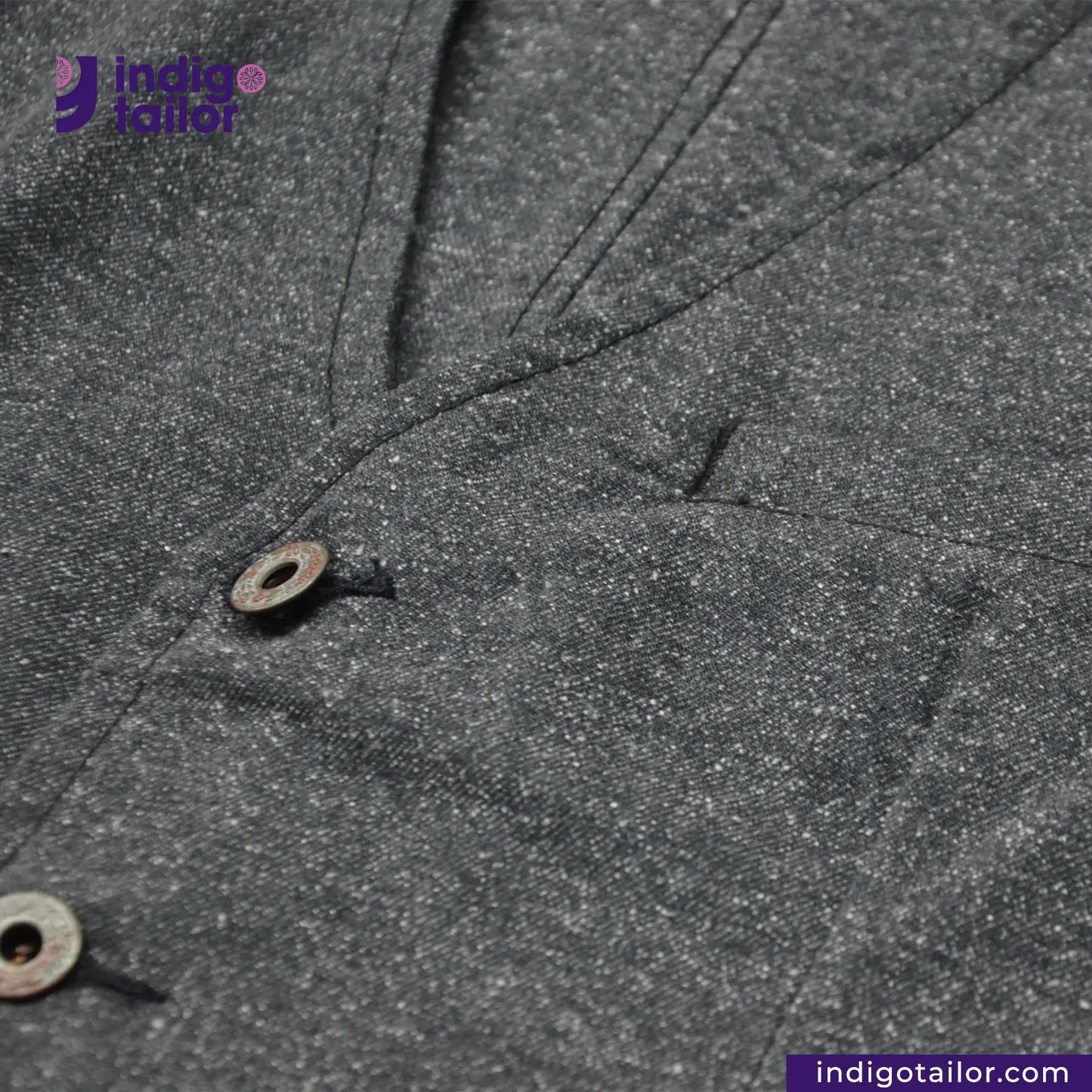 Close-up of BLACK TWEED WORK VEST with a button, featuring Indigotailor logo.