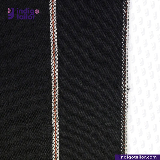 Close-up of BLACK x BLACK SEVLEDGE DENIM fabric with a visible brand logo at the top left corner.