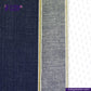 Close-up of BLUE AZUL RASTA SELVEDGE DENIM fabric with a visible brand logo on a white background