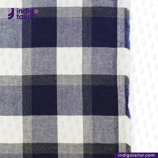 Close-up of BRUSHED FLANNEL INDIGO BEIGE GREY CHECK fabric with 'Indigotailor' branding.