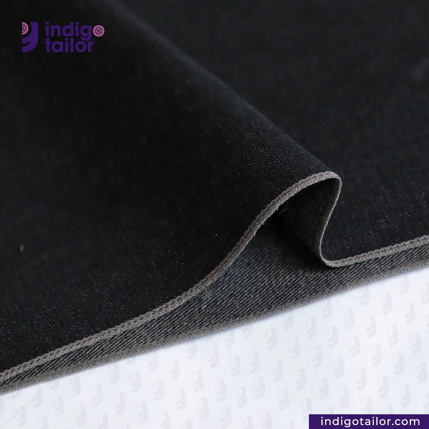 CHARCOAL SMOKE BLACK SELVEDGE DENIM fabric with a visible brand logo on a white background