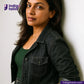 Woman wearing a CLASSIC BLACK SELVEDGE DENIM jacket against a white wall with 'Indigo Tailor' branding.