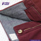 Close-up of Chino Burgundy fabric with a button and zipper, branded 'Indigotailor'.