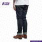 Person wearing Comfort Stretch Denim jeans and brown boots on a white background with 'Indigo Tailor' branding.