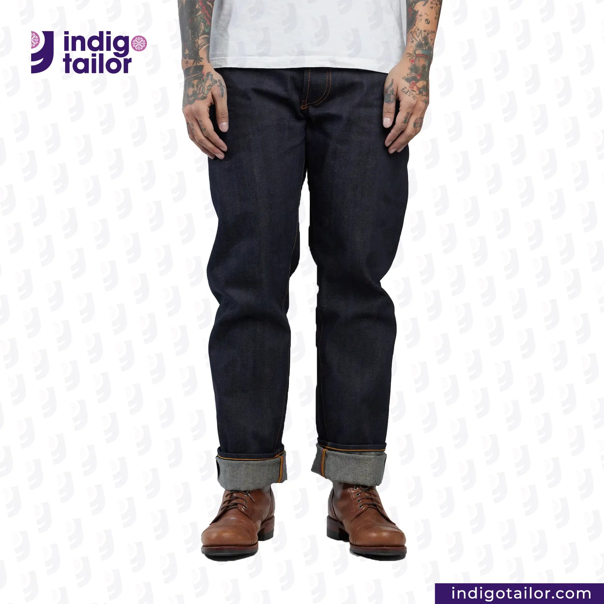 Person wearing DEEP BLUE OMBRÉ CAST DENIM jeans and brown boots on a white background with 'Indigo Tailor' branding.