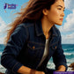 Woman wearing a DEEP INDIGO GREENCAST SELVEDGE DENIM jacket with a scenic background and Indigotailor logo.