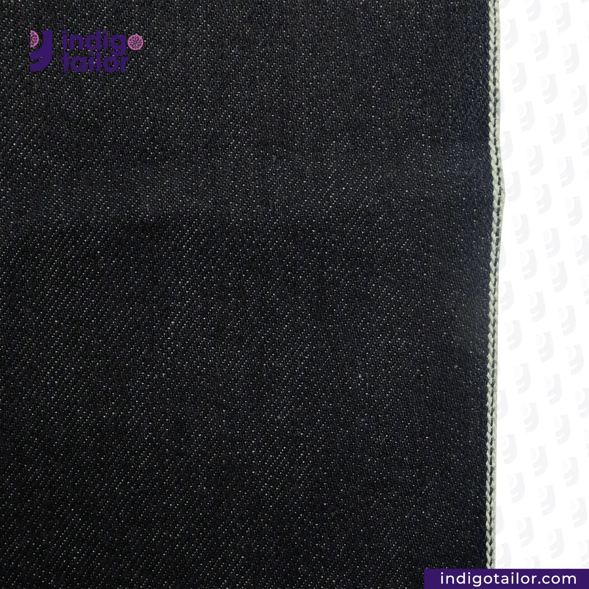 Close-up of DEEP INDIGO GREENCAST SELVEDGE DENIM fabric with a visible brand logo on a white background