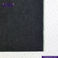 Close-up of DEEP INDIGO GREENCAST SELVEDGE DENIM fabric with a visible brand logo on a white background