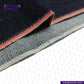Close-up of DEEP INDIGO TWO COLORED EDGE SELVEDGE DENIM fabric with a visible brand logo on a white background