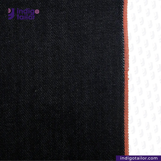 Close-up of DEEP INDIGO TWO COLORED EDGE SELVEDGE DENIM fabric with a visible brand logo on a white background