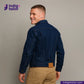 Man wearing a DOUBLE DIPPED TRIPLE PLEAT REPRO denim jacket with 'Indigo Tailor' logo and website on a gray background