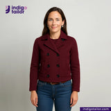 Woman wearing a Double Breasted Knit Peacoat (Burgundy) with 'Indigo Tailor' logo above her.