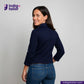 Woman wearing a Double Breasted Knit Peacoat (Navy) jacket and blue jeans with 'Indigo Tailor' logo and website on a gray background