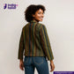Woman wearing a EARTH JACKET and jeans with 'Indigo Tailor' logo.