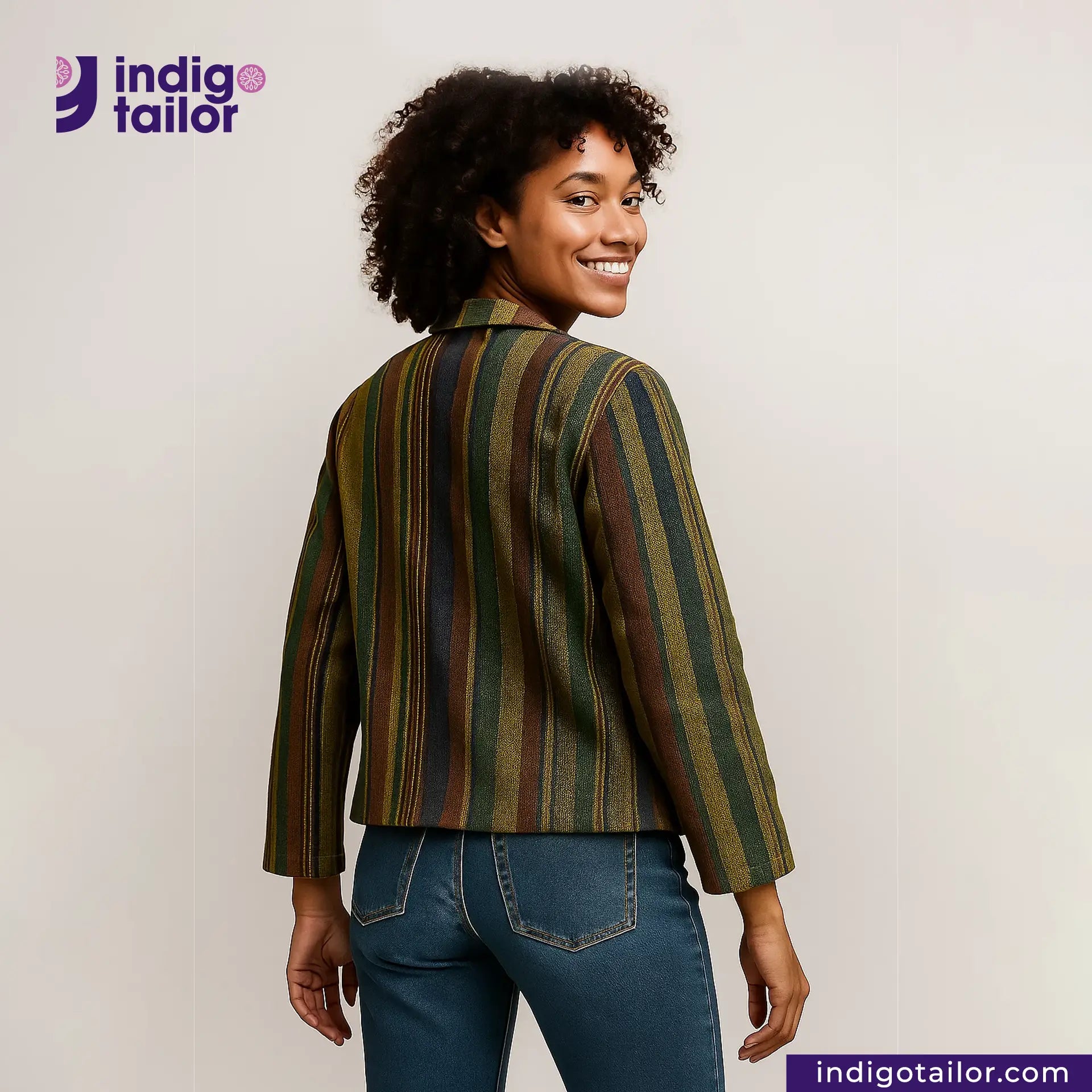 Woman wearing a EARTH JACKET and jeans with 'Indigo Tailor' logo.