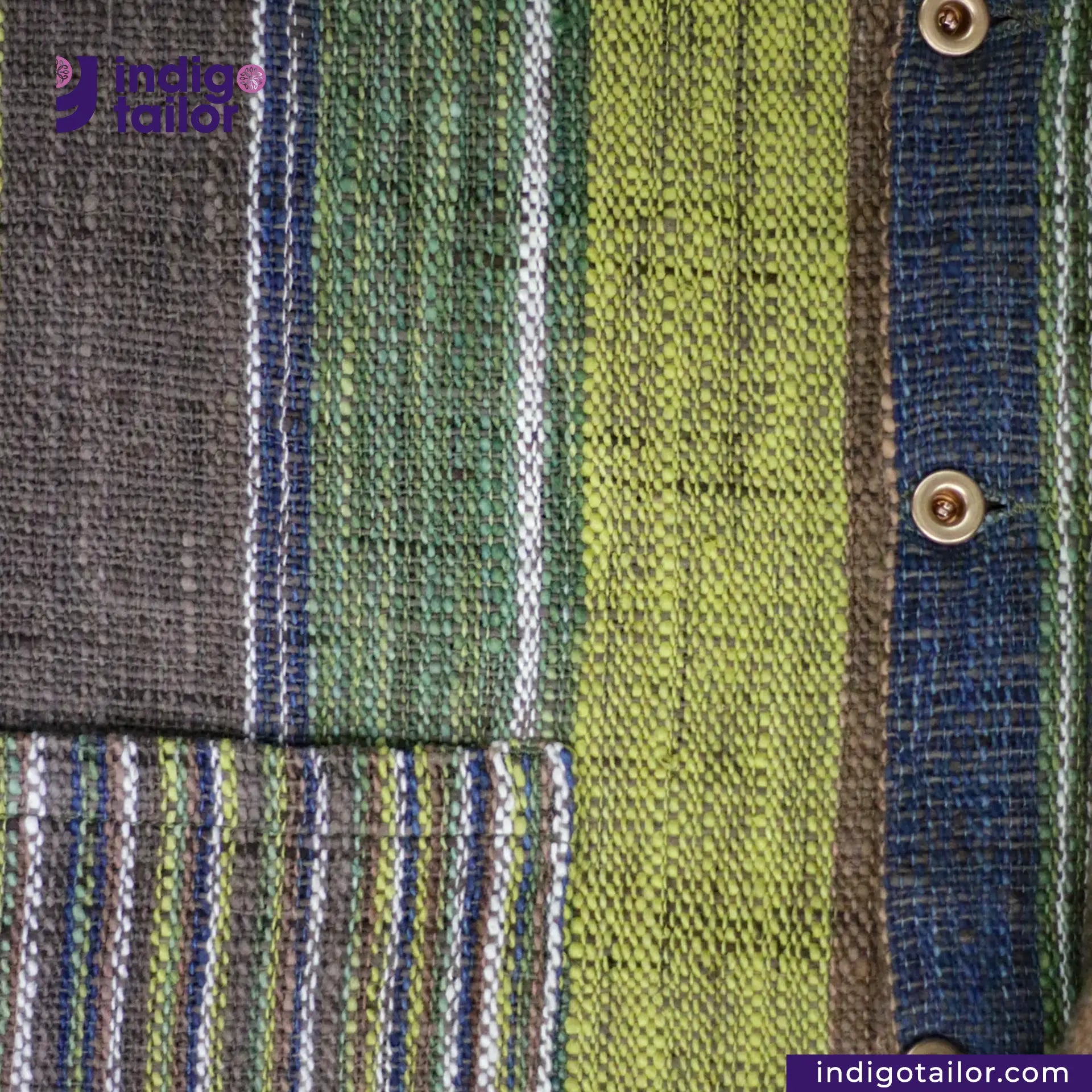 Close-up of a EARTH JACKET fabric with green, blue, and gray colors, featuring a brand logo in the corner.