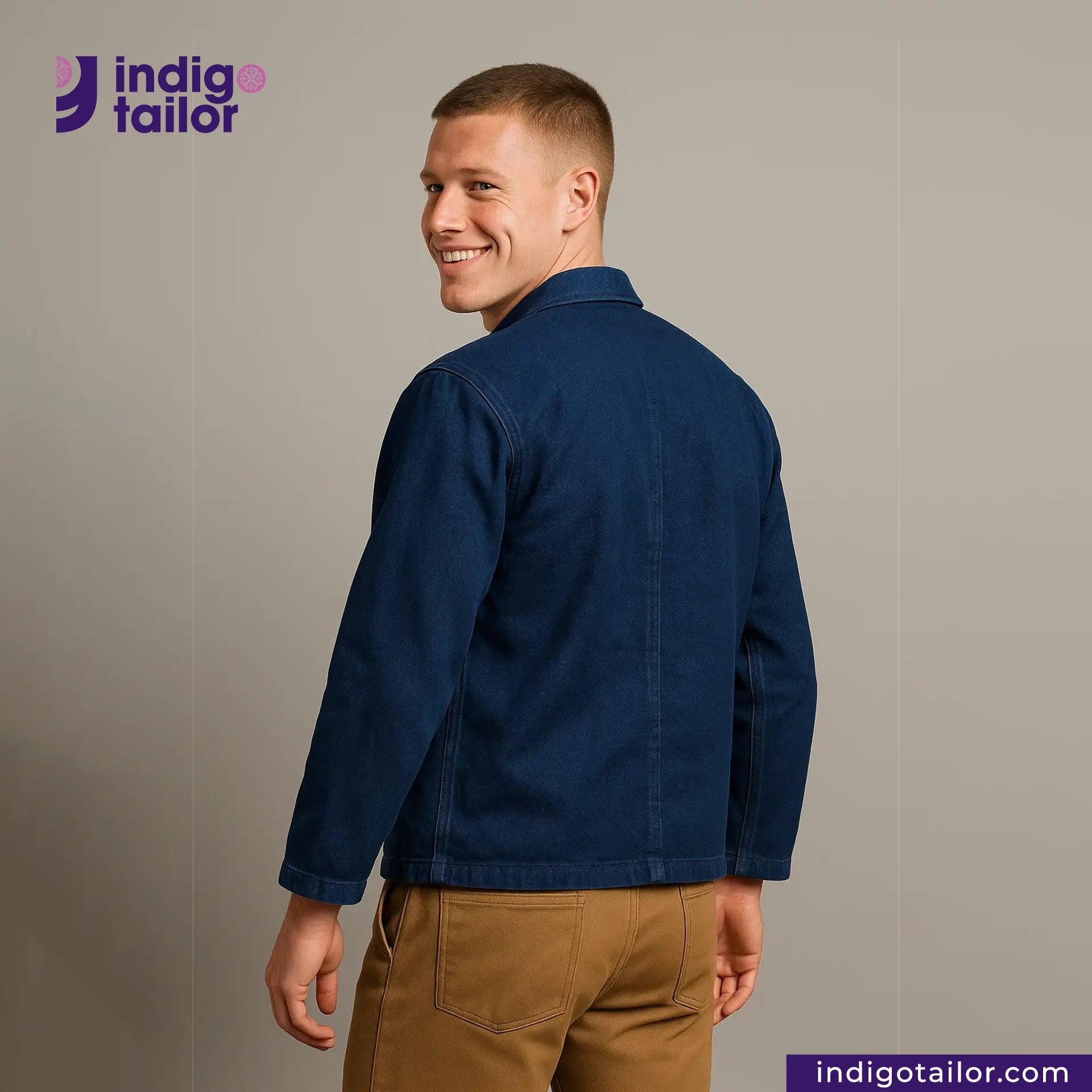 Man wearing a EASY JACKET INDIGO CANVAS with 'Indigo Tailor' logo and website on a gray background