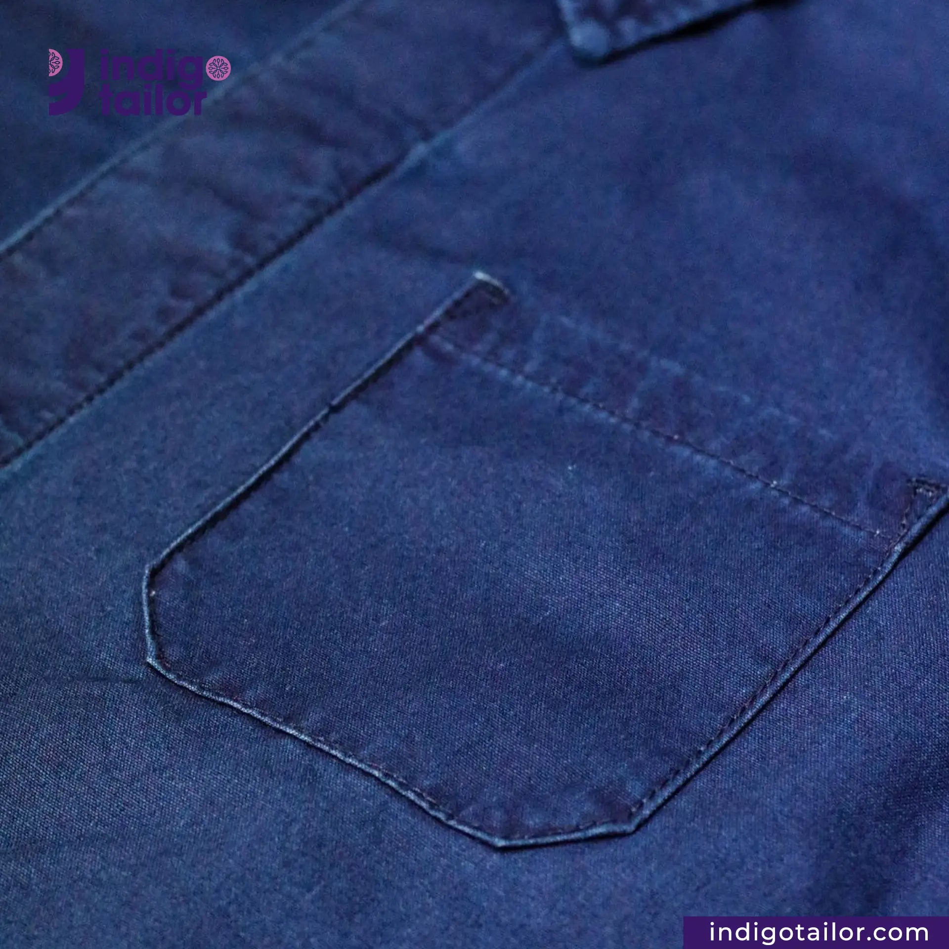 Close-up of a EASY JACKET INDIGO CANVAS pocket with 'Indigo Tailor' branding.