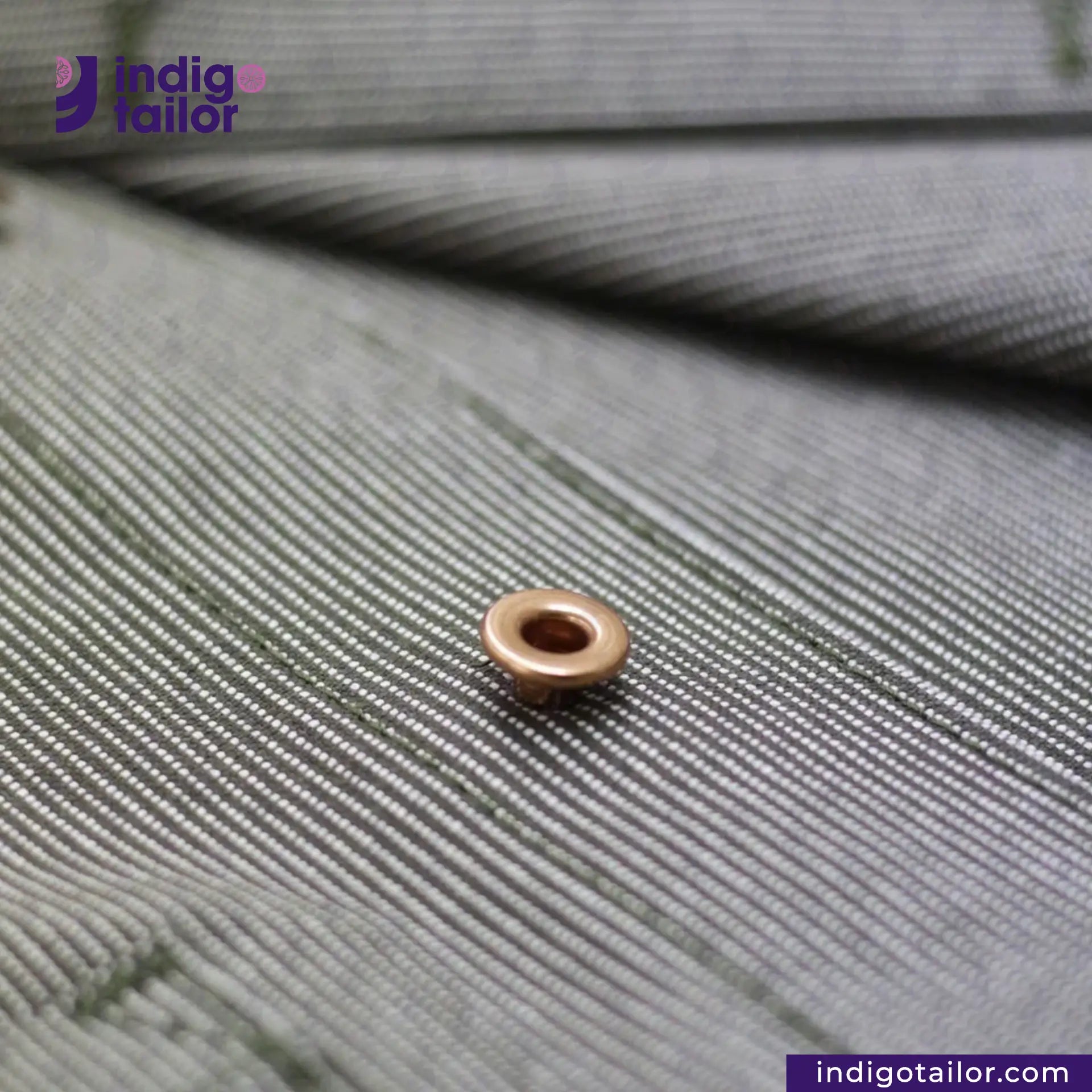 Bronze button on EASY JACKET OLIVE WABASH ONE WASH with 'Indigotailor' branding.