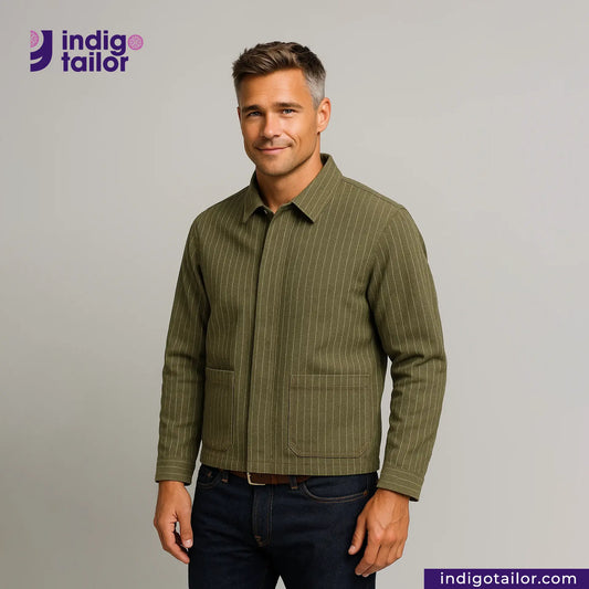 Man wearing a EASY JACKET OLIVE WABASH ONE WASH with 'Indigo Tailor' logo and website on gray background
