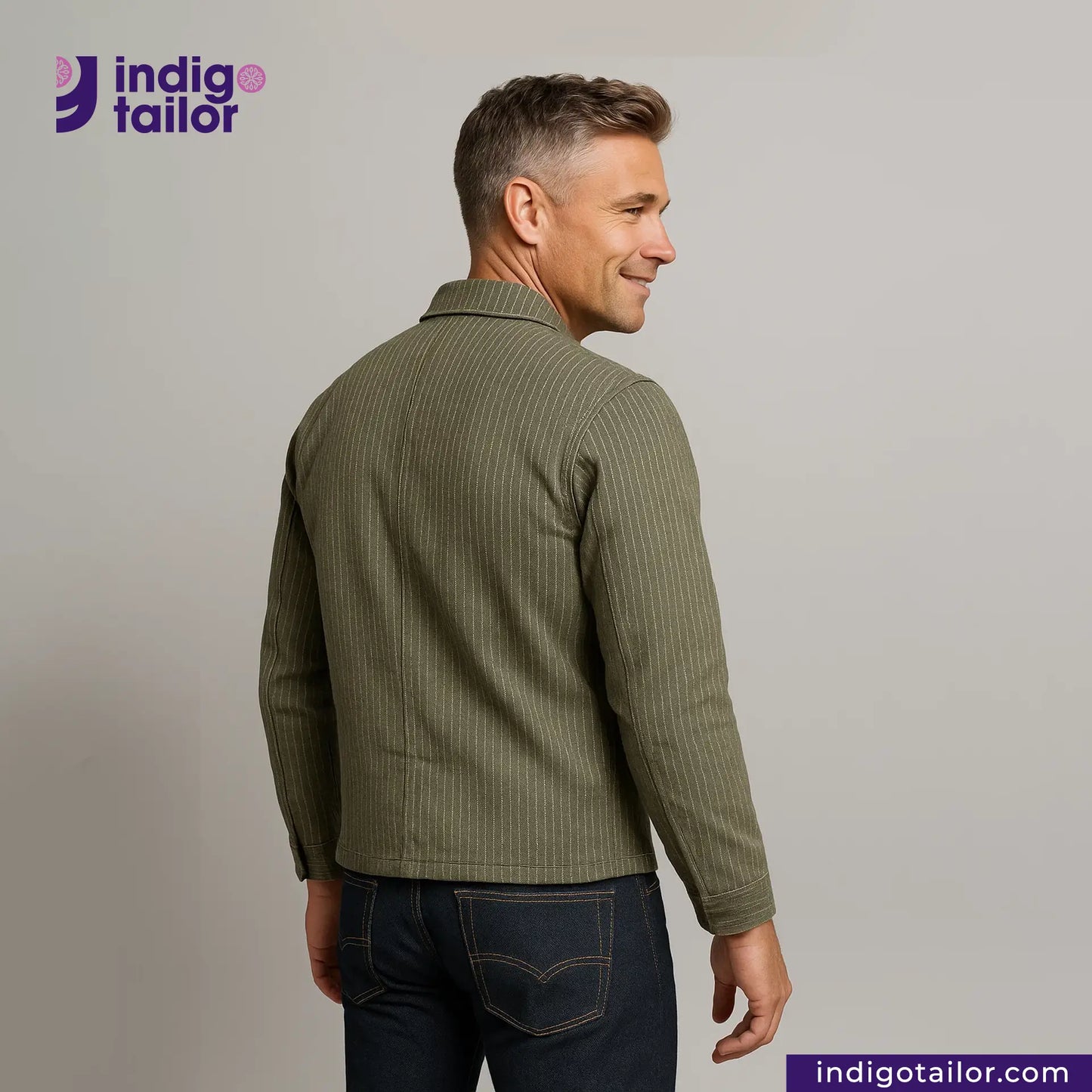 Man wearing a EASY JACKET OLIVE WABASH ONE WASH with 'Indigo Tailor' logo and website on a gray background