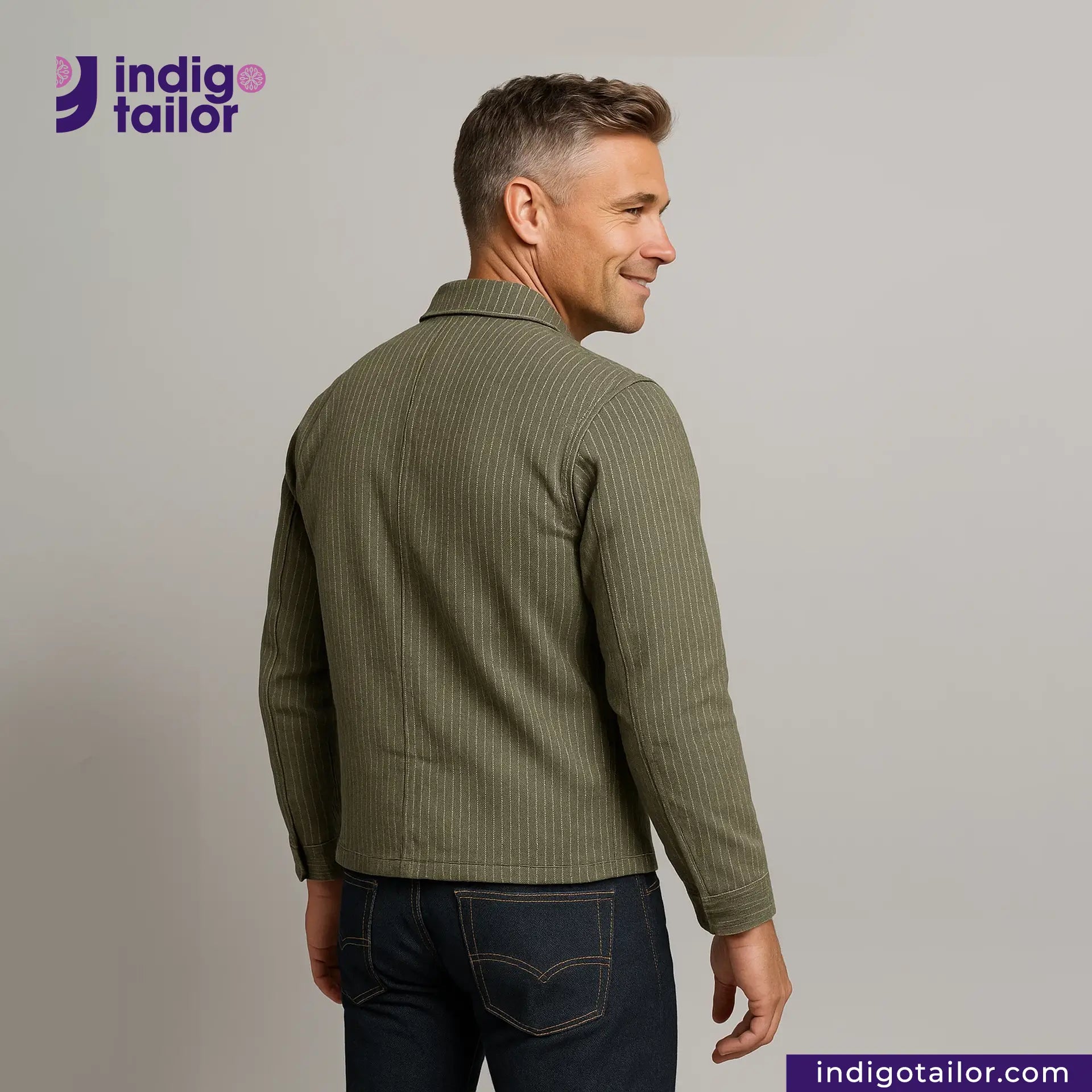 Man wearing a EASY JACKET OLIVE WABASH ONE WASH with 'Indigo Tailor' logo and website on a gray background