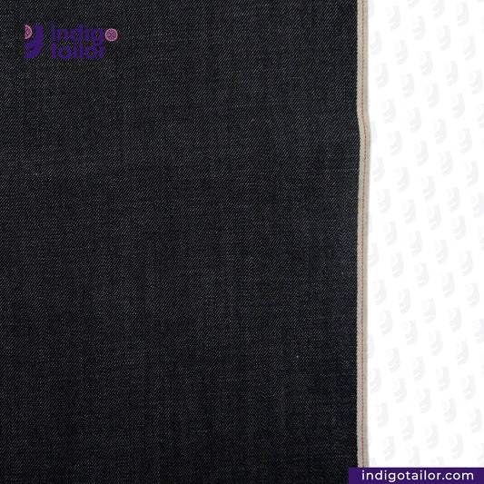 Close-up of FEATHERWEIGHT SELVEDGE DENIM denim fabric with a visible brand logo on a white background