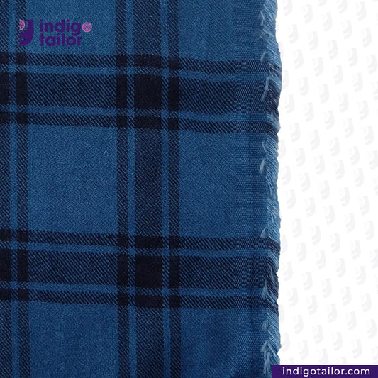 FLANNEL AN ARRAY OF BLUES fabric with 'Indigo Tailor' logo on a white background