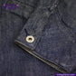 Close-up of a button on a FLIGHT JACKET with 'Indigotailor' branding.