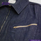 Close-up of a FLIGHT JACKET with a zipper pocket, brand 'Indigo Tailor' visible.