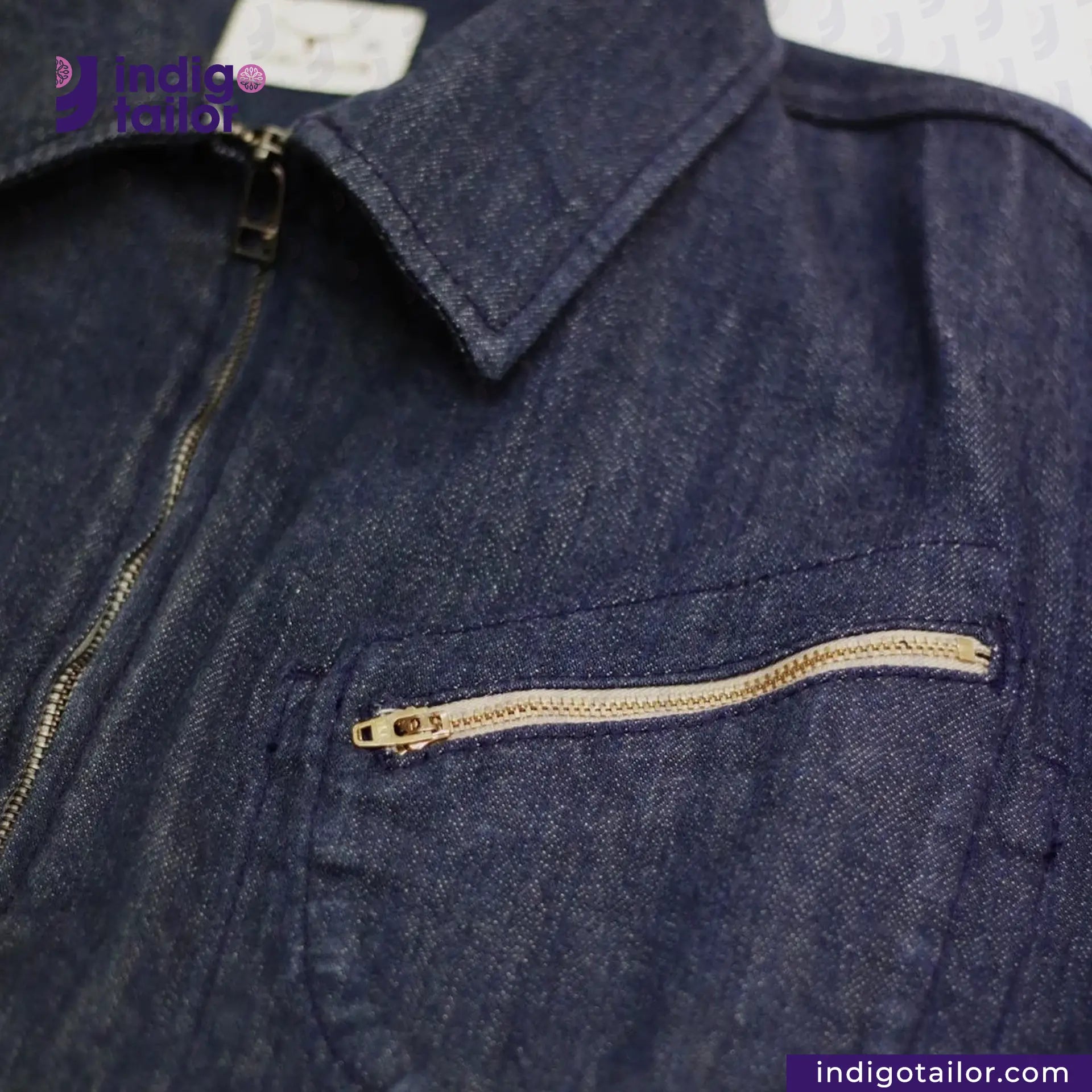 Close-up of a FLIGHT JACKET with a zipper pocket, brand 'Indigo Tailor' visible.