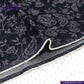 FLORAL EMBOSSED DENIM fabric with white border on a white background, featuring Indigotailor.com branding.