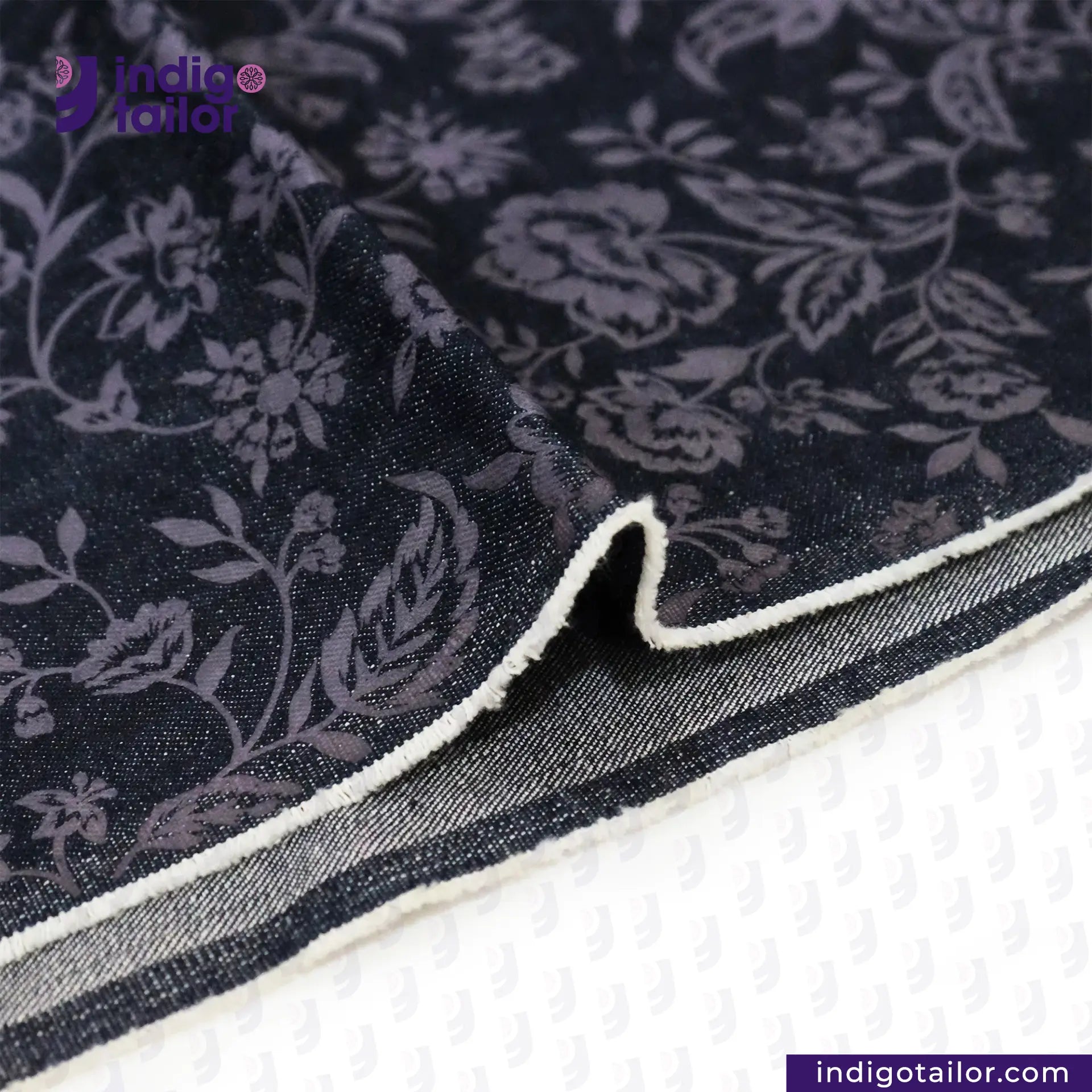 FLORAL EMBOSSED DENIM fabric with white border on a white background, featuring Indigotailor.com branding.