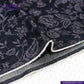 FLORAL EMBOSSED DENIM fabric with white border on a white background, featuring Indigo Tailor logo.