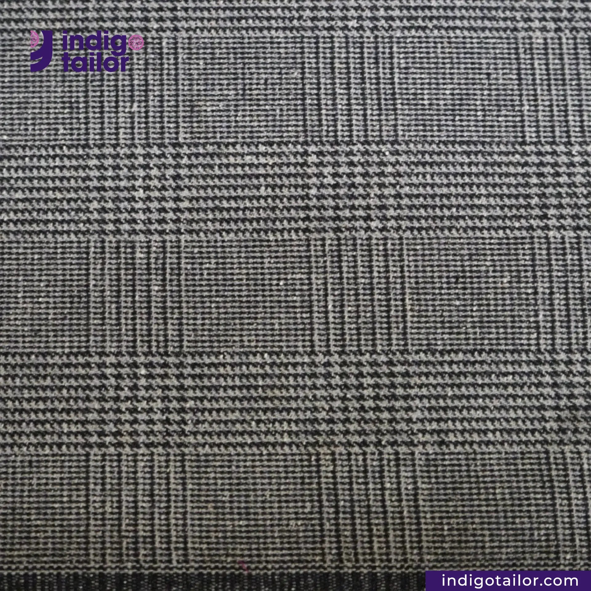Close-up of GREYHOUND TWEED PLAID fabric with Indigotailor logo and website.
