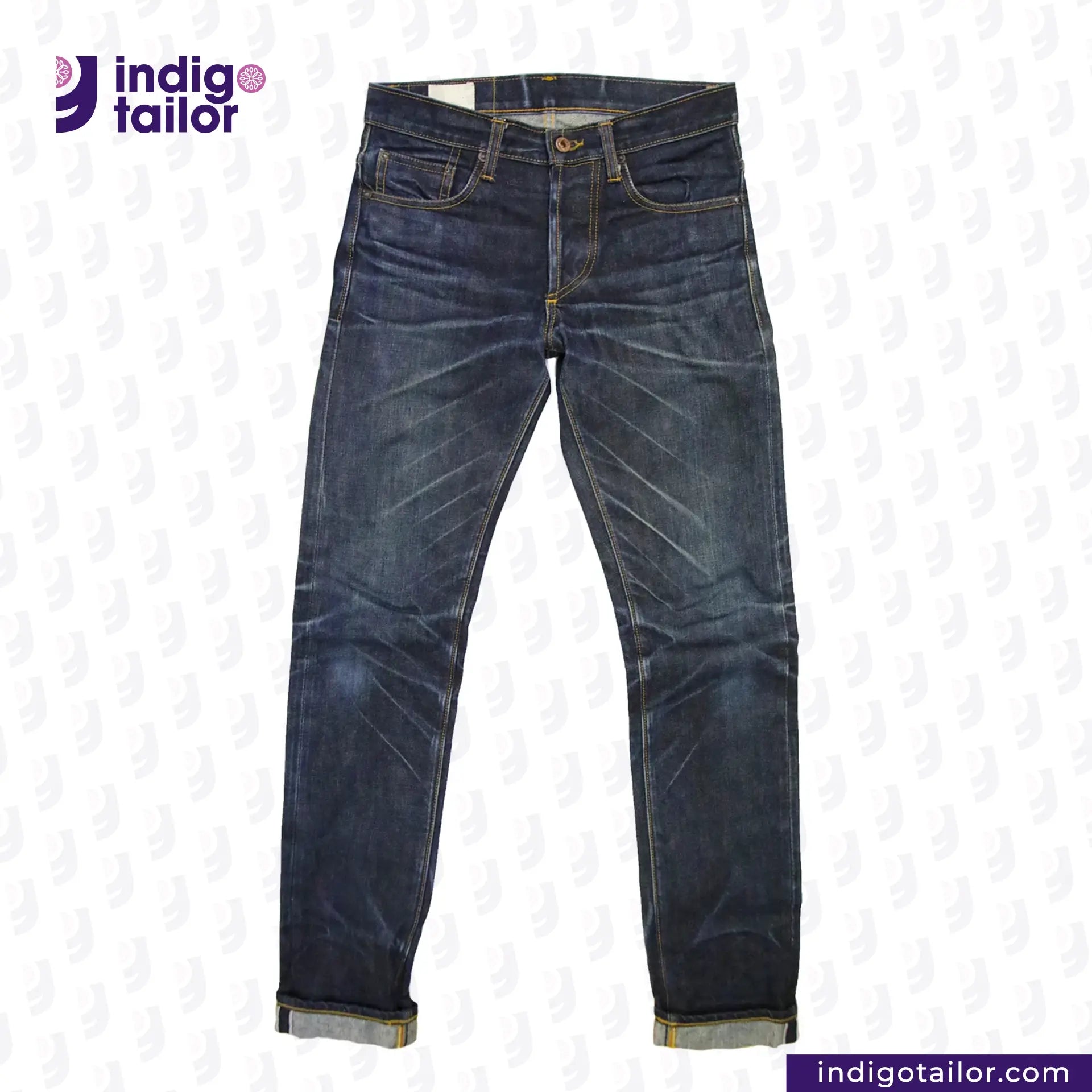 Pair of blue jeans with 'Indigotailor' logo on a white background
