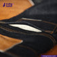 Close-up of dark denim fabric with 'indigotailor' branding.