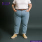 Person wearing ICE BLUE SELVEDGE DENIM jeans and a white shirt with a dark background