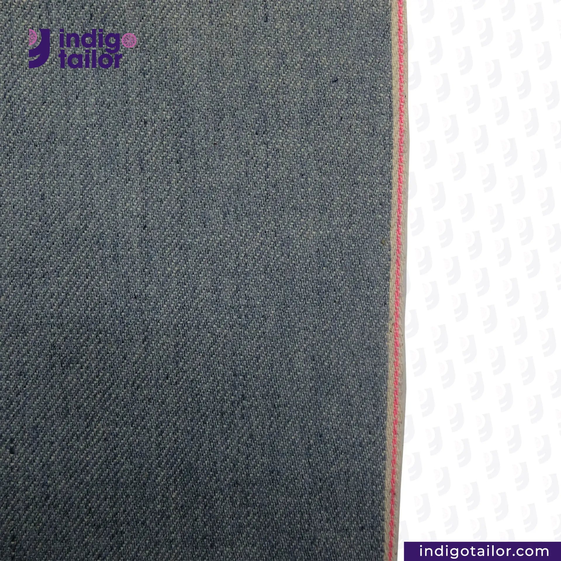 Close-up of ICE BLUE SELVEDGE DENIM denim fabric with a visible brand logo on a white background