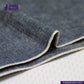 Close-up of  INDIGO DUCK CANVAS fabric with 'indigotailor' branding.