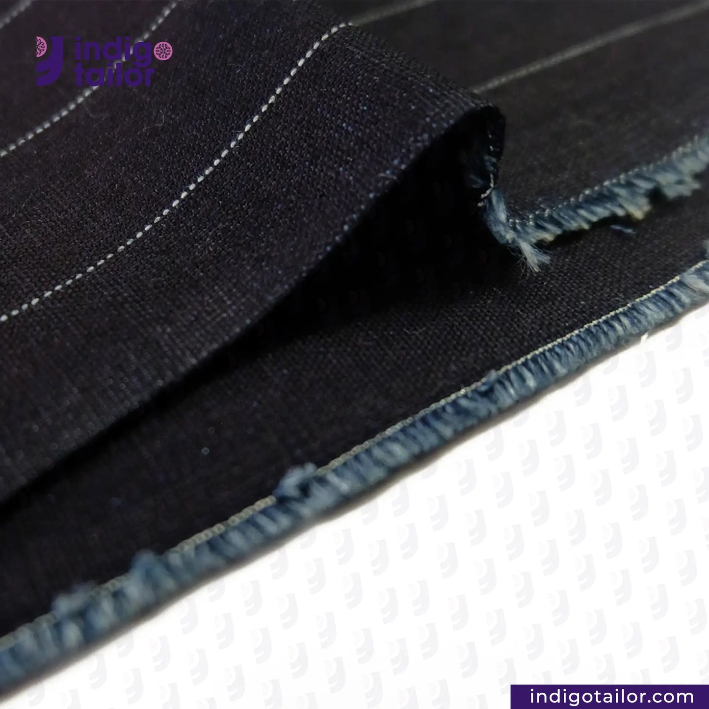 Close-up of INDIGO PINSTRIPES fabric with 'Indigo Tailor' branding.