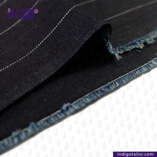 Close-up of INDIGO PINSTRIPES fabric with 'Indigo Tailor' branding.