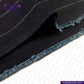 Close-up of INDIGO PINSTRIPES denim fabric with visible stitching on a white background, featuring the 'indigotailor' brand.