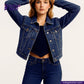 Woman wearing a INDIGO SASHIKO jacket and jeans with Indigo Tailor logo.
