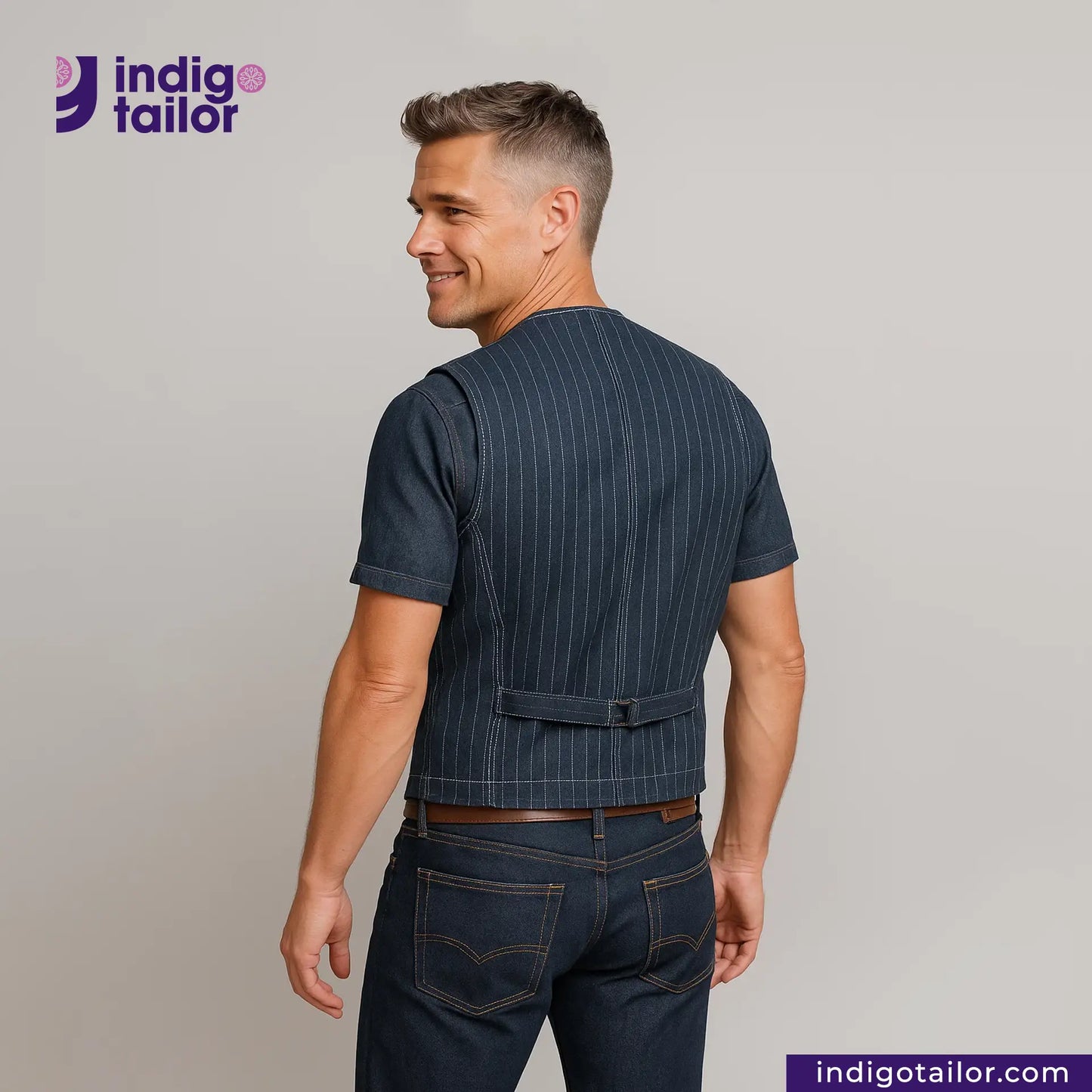 Man wearing a INDIGO VINTAGE STRIPE WORK VEST and jeans with 'Indigo Tailor' logo.